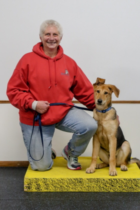 Dog and owner posing for obedience class picture